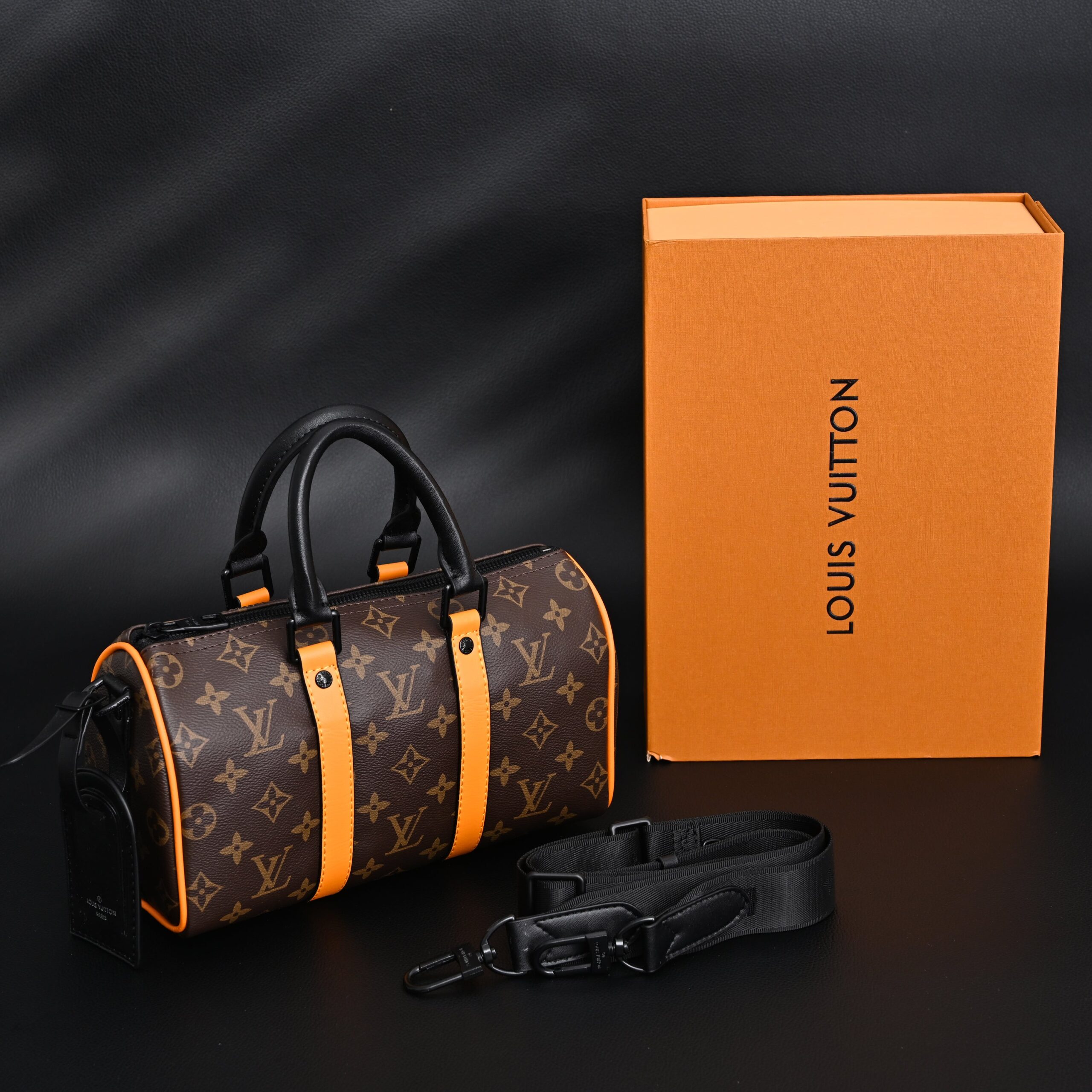 Louis Vuitton Keepall Bandoulière 50 – Monogram Canvas with Neon Orange Trim - Image 1