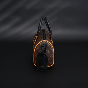 Louis Vuitton Keepall Bandoulière 50 – Monogram Canvas with Neon Orange Trim - Image 4