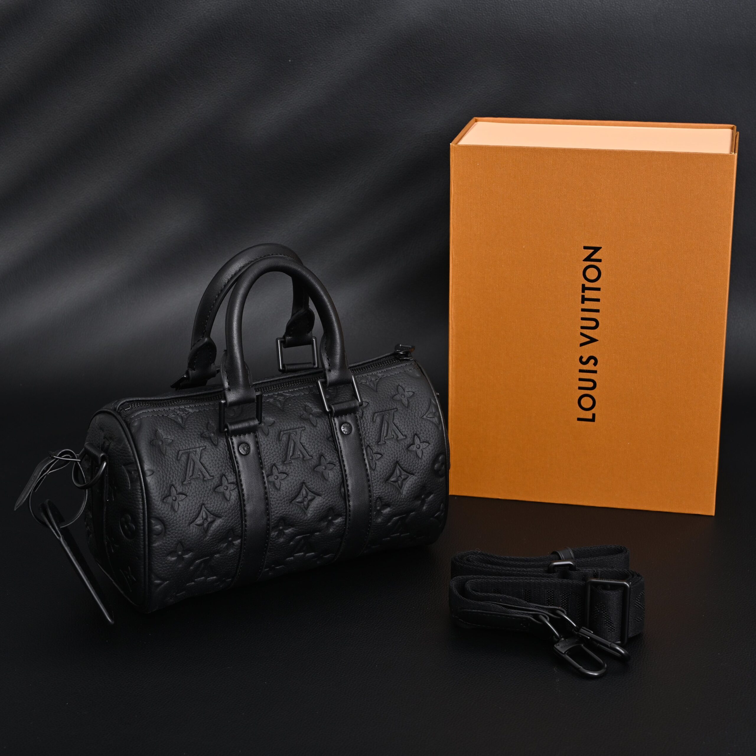 Louis Vuitton Keepall Bandoulière 50 – Monogram Shadow Black Leather - Image 1