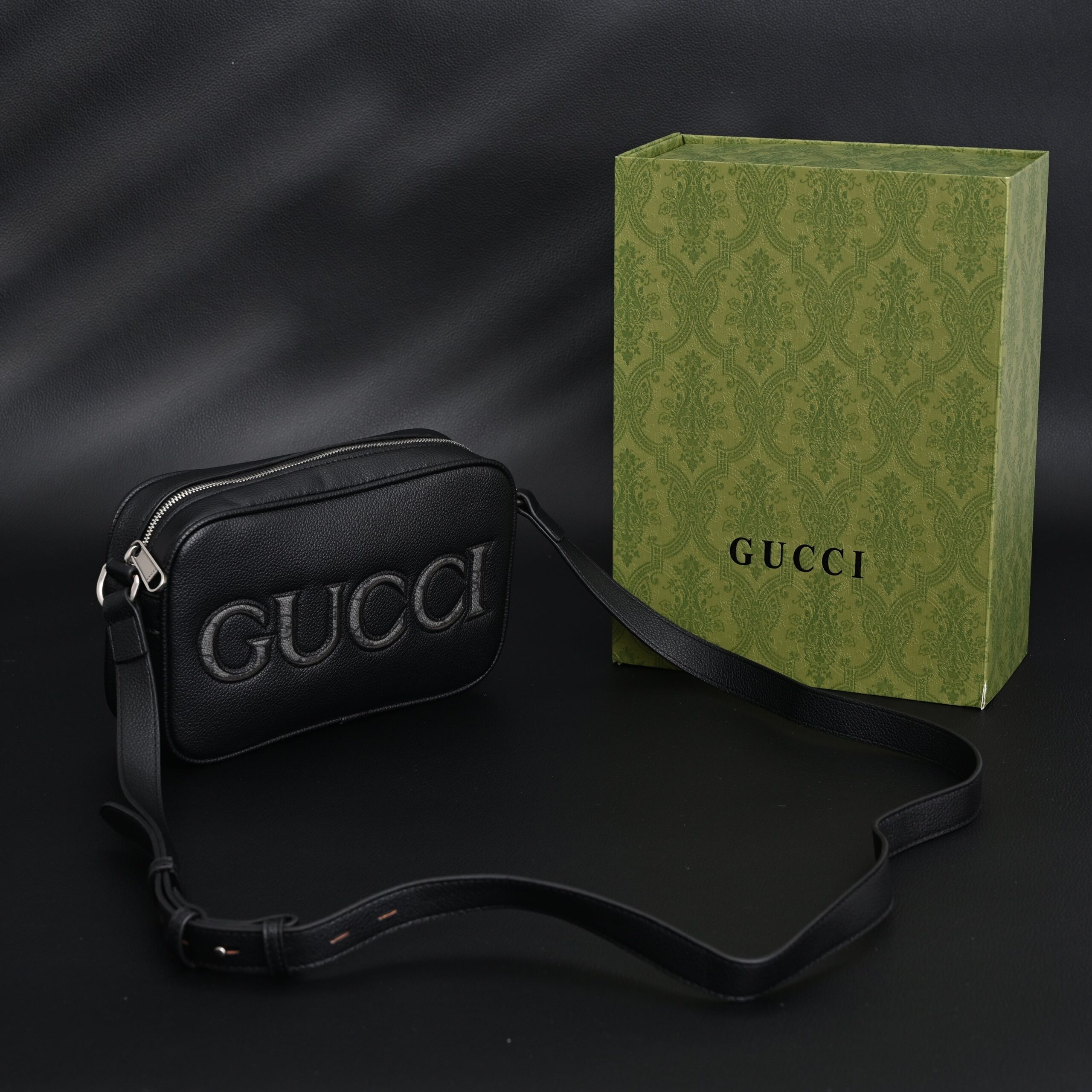 Gucci Black Leather Embossed Logo Belt Bag - Image 1