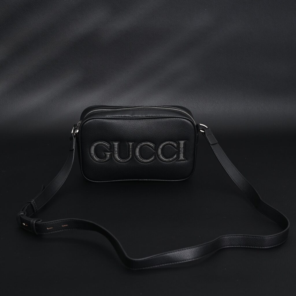 Gucci Black Leather Embossed Logo Belt Bag