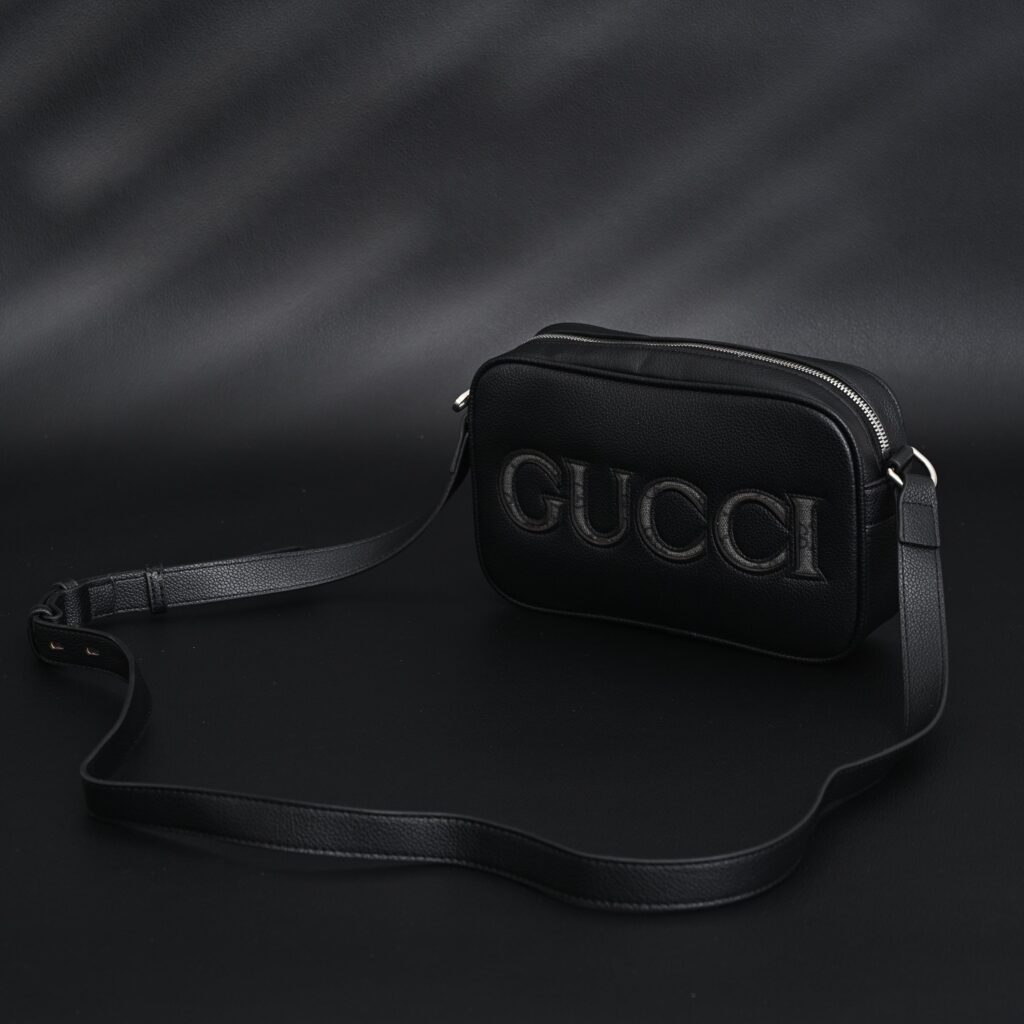 Gucci Black Leather Embossed Logo Belt Bag