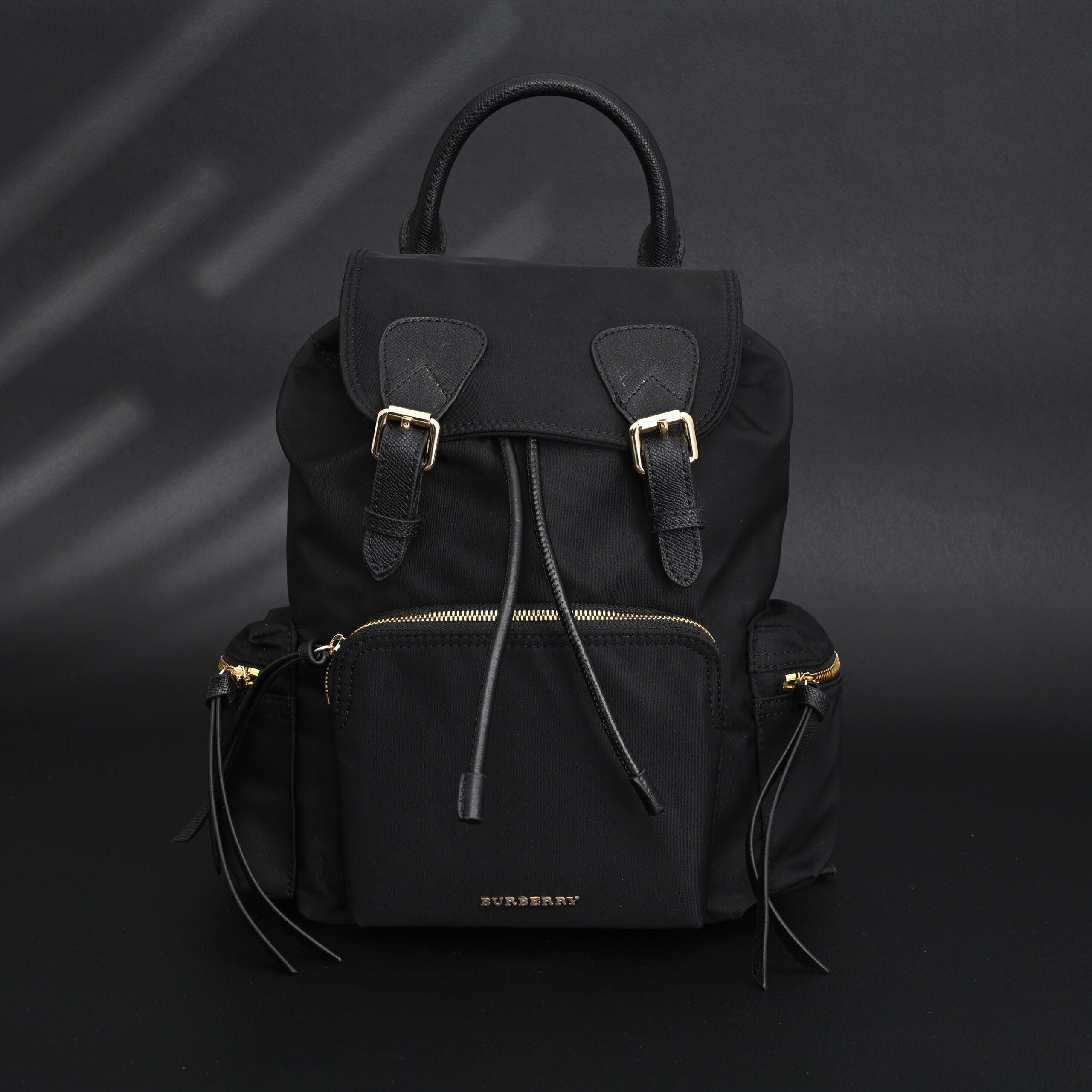 Burberry The Rucksack – Black Nylon & Leather Backpack with Gold-Tone Hardware - Image 1